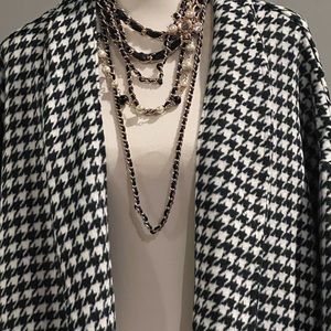 Gingham black and white pockets in front collared button up buttons in front